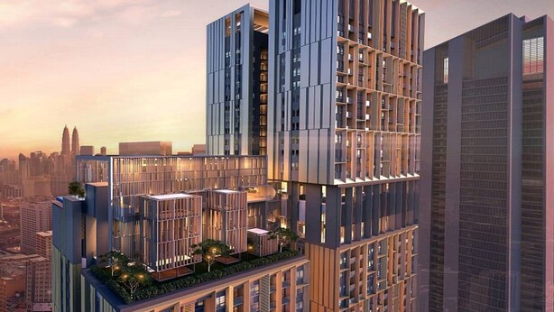 A modern high-rise building with multiple balconies, large windows, and a rooftop garden. - Luxury Suite Lucentia BBCC Infinity Pool (Kuala Lumpur)