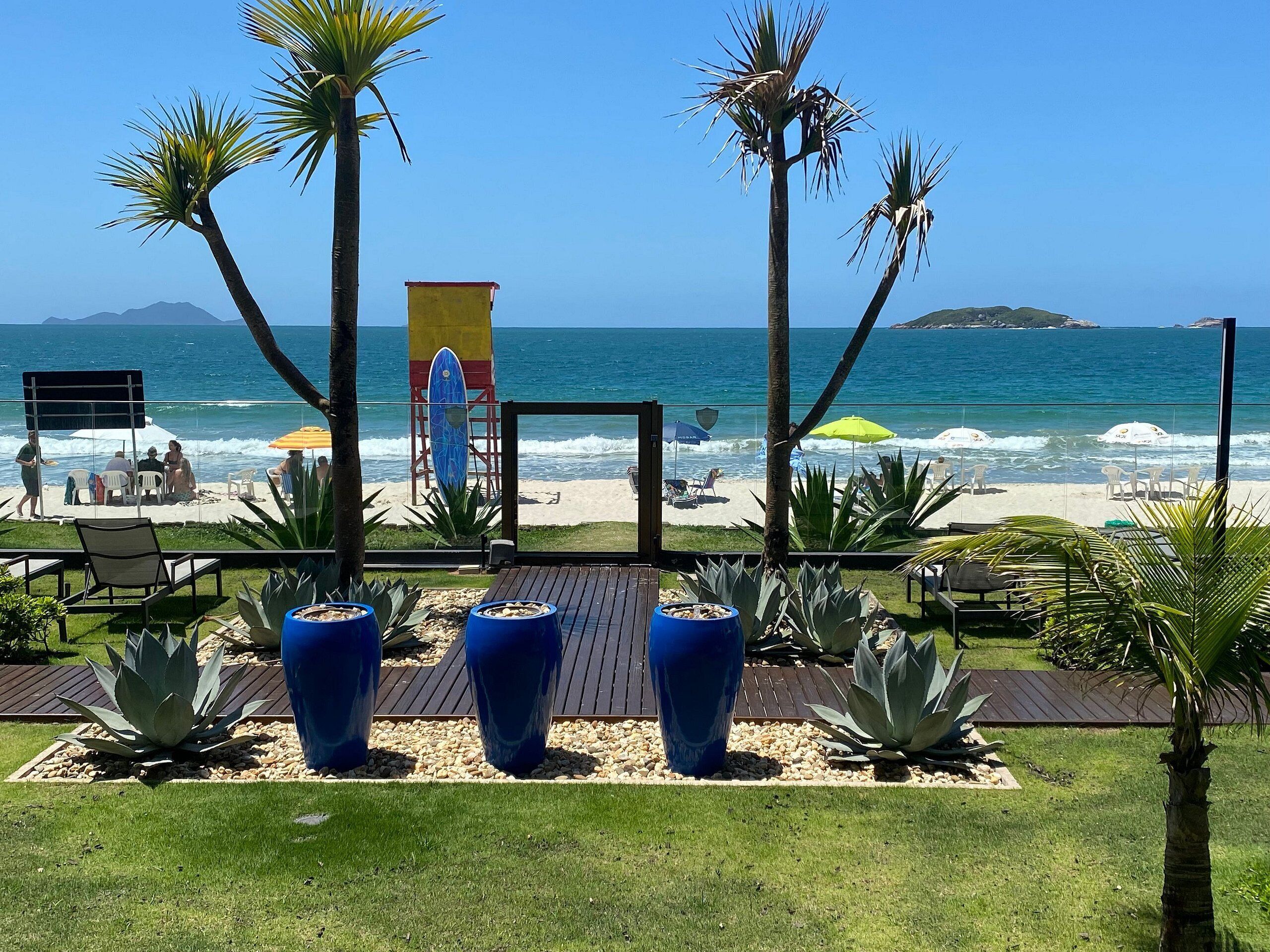 On the beach, white sand, sun loungers, beach umbrellas