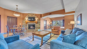 TV, fireplace - Top-Floor Condo Overlooking the River – Pet Friendly! (Wisconsin Dells)