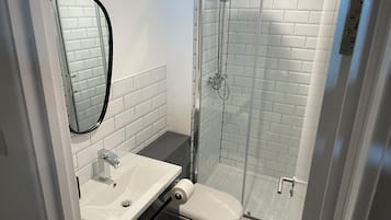 Shower, towels, soap, toilet paper