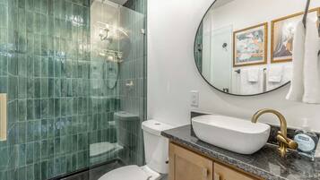 Shower, hair dryer, towels, shampoo