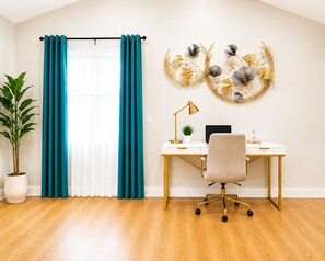 A room with a desk, chair, potted plant, and teal curtains. - 2 Apts, 2bd 2ba, Sleeps 10, Clean & Reliable, Near NYC (Scotch Plains)