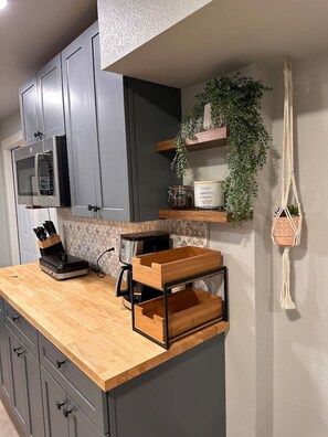 Fridge, microwave, coffee/tea maker, toaster