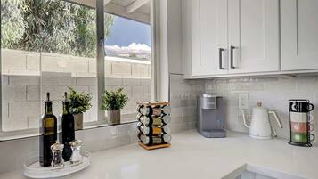 Coffee/tea maker, fridge, microwave, oven
