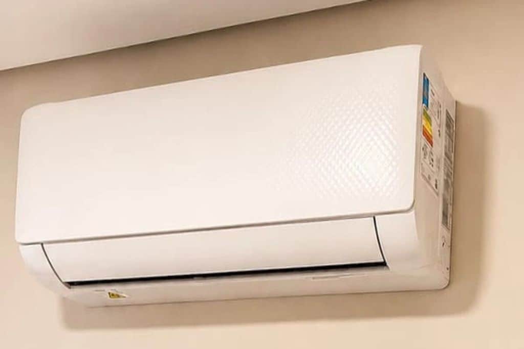 A white air conditioning unit mounted on a wall.