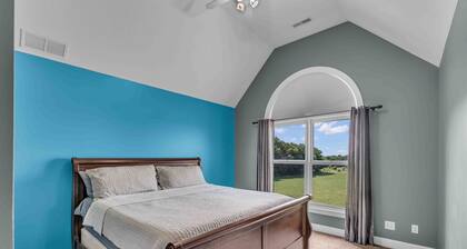 Large country place on acreage with pond and plenty of room.