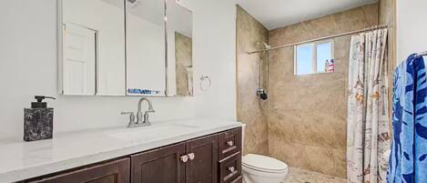 Shower, towels, soap, toilet paper