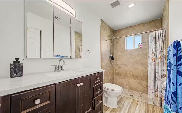 Shower, towels, soap, toilet paper