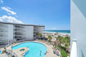 A hotel with a swimming pool, beach view, and multiple balconies. - Dunes of Seagrove 302B - Gulf front with great views! (Santa Rosa Beach)