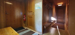 A wooden interior with a fire extinguisher, a map, and a bench. - Sauna | Wi-Fi | Terrace | Wood stove | Cable TV (Lofsdalen)