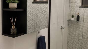 Shower, towels, soap, toilet paper