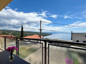 A balcony with a view of a lake and distant hills. - Jadranka by Interhome (Opatija/Pobri)