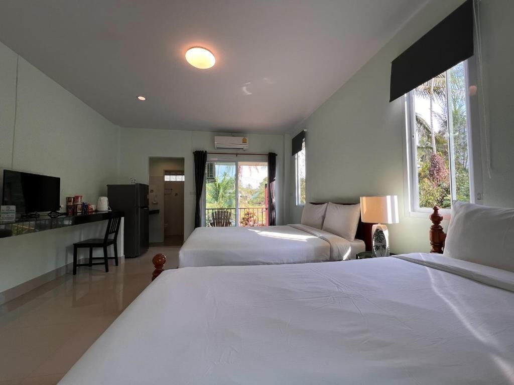 Standard Triple Room, Lanai, Garden View | Blackout curtains, free WiFi