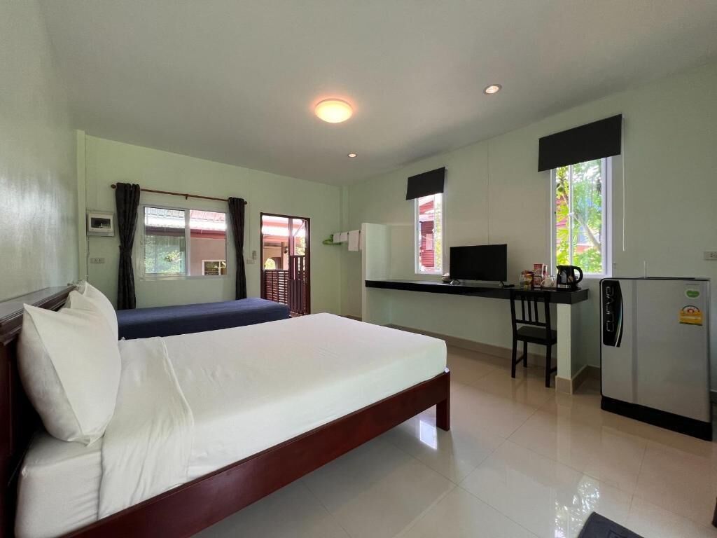 Standard Double Room, Lanai, Garden View | Blackout curtains, free WiFi