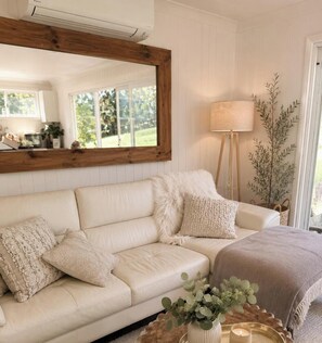 Living area - Luxury off-grid retreat with boutique cottage charm and friendly farm animals (Holgate)