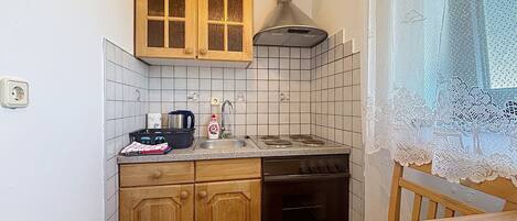 Fridge, oven, cookware/dishes/utensils