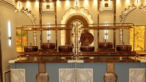 A luxurious bar area with ornate metal railings, decorative panels, and a central mirror. - S S RESIDENCY (Gorakhpur)