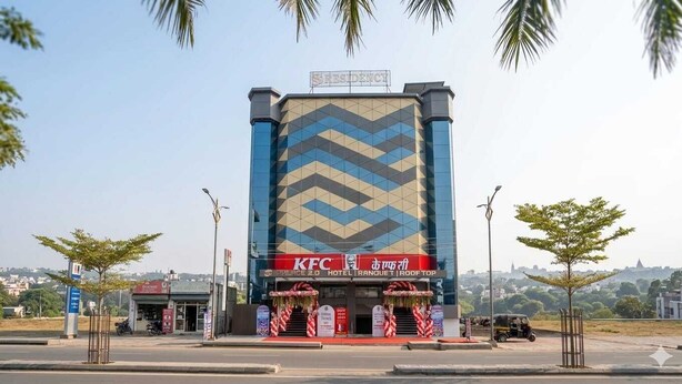 A KFC branded hotel with a modern geometric facade, a visible entrance, and a clear view of the surrounding area. - S S RESIDENCY (Gorakhpur)