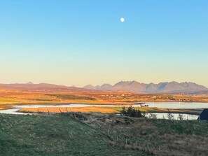 A landscape with mountains, a body of water, and a small settlement. - 3 bedroom accommodation in Roag, near Dunvegan (Roag, near Dunvegan)