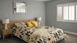 Une chambre à coucher comprenant un lit, deux tables de chevet, une commode, un miroir et une fenêtre avec des stores.