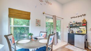 A dining area with a round table, chairs, and a view through a window. - ‘Tweet Suite’ - Studio Getaway 7 Mi to Dtwn Tyler (Tyler)