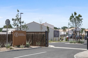 A gated entrance to a property with a sign for 'Pierre & Vacances.' - Picturesque 6-Person Duplex Oasis (Les Sables-d'Olonne)