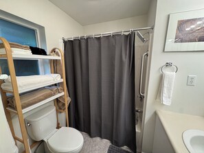 Hair dryer, towels, shampoo, toilet paper