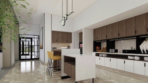 A modern kitchen with a central island, wooden cabinets, and a geometric patterned floor. - TownePlace Suites by Marriott Vaughan (Vaughan)