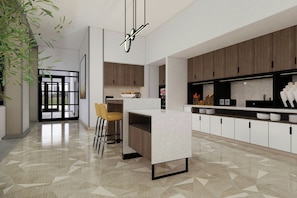 A modern kitchen with a central island, wooden cabinets, and a geometric patterned floor.