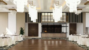 A spacious hall with a wooden floor, white tables with chairs, and large chandeliers. - TownePlace Suites by Marriott Vaughan (Vaughan)