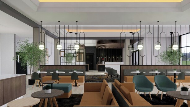 A modern interior with seating areas, tables, hanging pendant lights, and large windows. - TownePlace Suites by Marriott Vaughan (Vaughan)