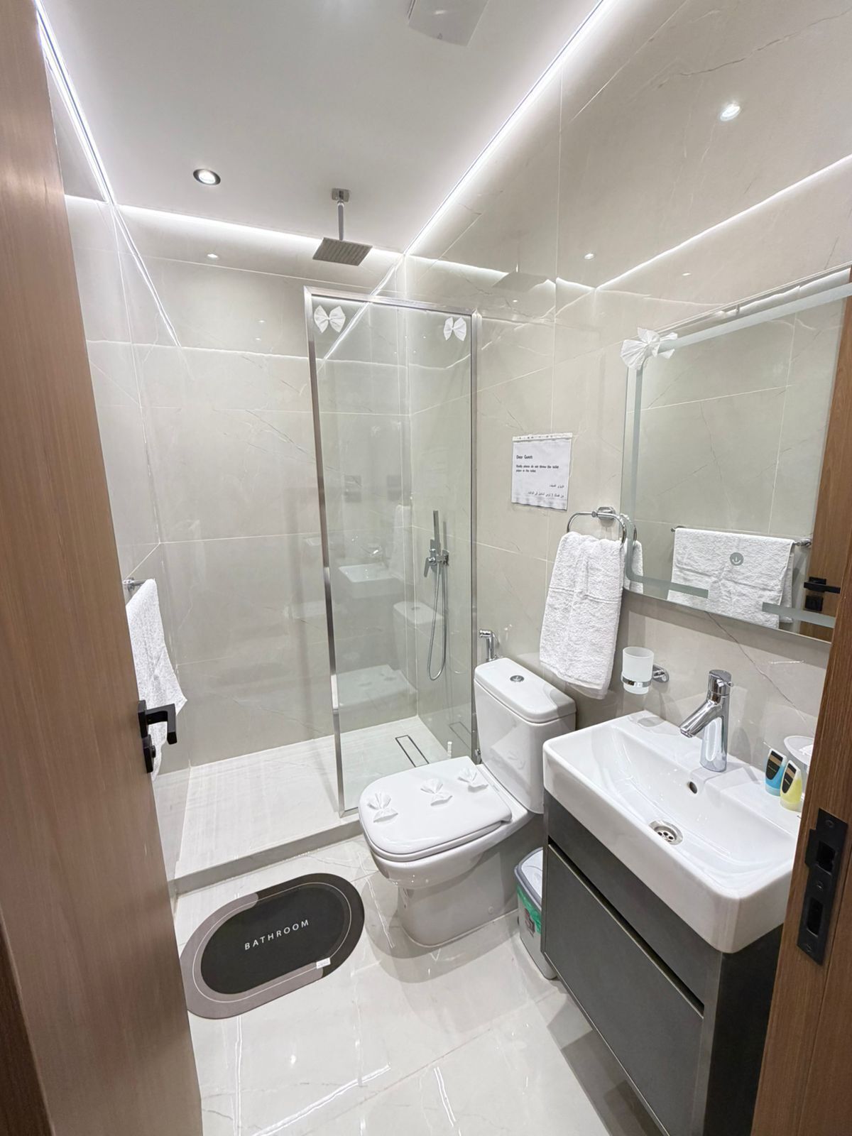 Separate tub and shower, hair dryer, slippers, towels