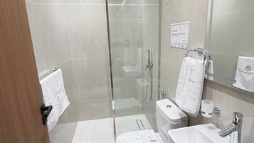 Deluxe Double Room, City View | Bathroom | Separate tub and shower, hair dryer, slippers, towels