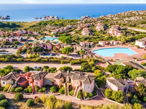 A coastal resort with villas, a large swimming pool, and a view of the sea. - Lavanda 2301 Bis by Interhome (Isola Rossa)
