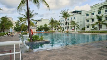 Outdoor pool, open 7:00 AM to 7:00 PM, pool umbrellas, sun loungers