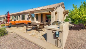 A house with an outdoor patio, a barbecue area, and a pool. - Golf, Hike & Unwind: Oro Valley Townhome w/ Patio! (Oro Valley)