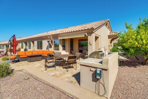 A house with an outdoor patio, a barbecue area, and a pool. - Golf, Hike & Unwind: Oro Valley Townhome w/ Patio! (Oro Valley)