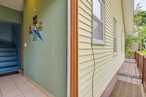 A house exterior with a blue staircase, a porch with a doormat, and a window with blinds. - 'nanas Tiny Flat' East Side Charmer Near Brown (Providence)