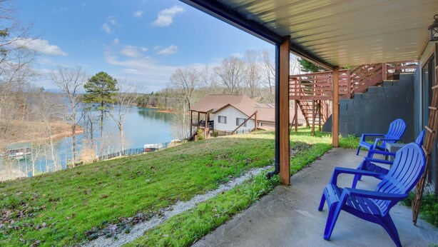 A covered outdoor area with a view of a lake, a house, and a set of stairs leading to a deck. - 3-unit Combo w/ Dock on Lake Keowee - Hike & Fish! (Seneca)