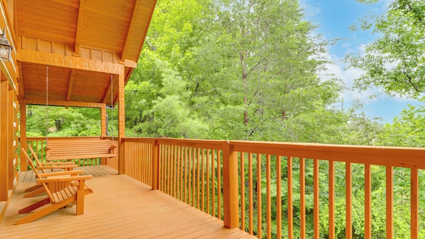 A wooden deck with a railing, a bench, and chairs. - Smoky Mtn Oasis w/ Hot Tub! 5 Mi to Skyland Ranch (Sevierville)