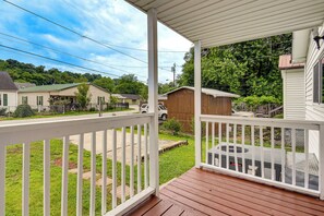 A wooden deck with a white railing, a clear view of the surrounding neighborhood, and a covered porch area. - 1/2 Mi to UK King's Daughters: Ashland Home! (Ashland)