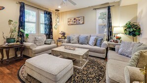 A living room with a sofa set, a coffee table, and a patterned rug. - Spacious + Pet-friendly Family Home in Tracy (Tracy)
