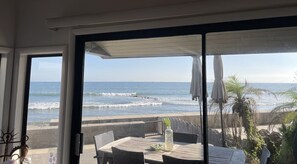 A view of the ocean from a covered patio with a table and chairs. - 20% Off Sept! Water Front, Perfect For Families* (Ventura)