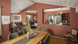 A modern living space with a dining area, a kitchen, and a seating area with a sofa and chairs. - Apartment Valentino 5 with shared Pool (Ližnjan)