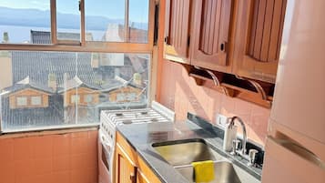 Apartamento família, vista para o lago | Cozinha privada
