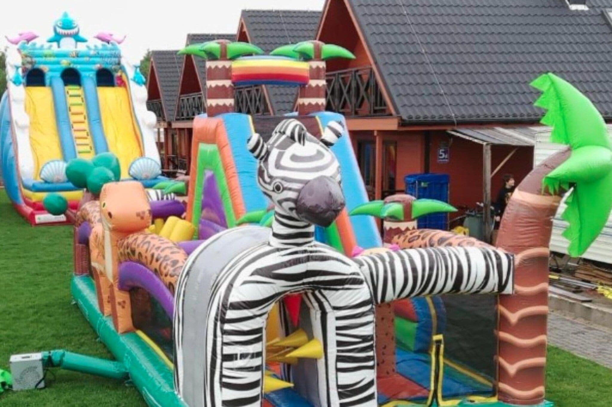 An inflatable playground with slides and climbing structures.