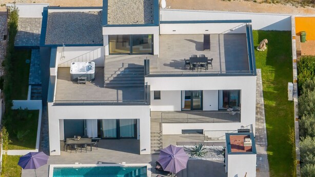A modern two-story house with a rooftop patio, a swimming pool, and a landscaped garden. - Villa Flokica with Heated Pool (Maslenica)