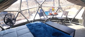 Unplug and unwind in our secluded off-grid glamping dome, nestled by a private lake. Enjoy the peace and quiet with all the comforts of home.