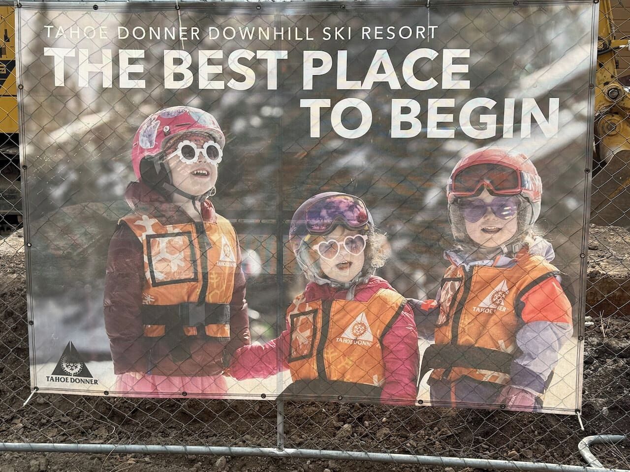 A promotional poster for Tahoe Donner Downhill Ski Resort with the text 'THE BEST PLACE TO BEGIN'.