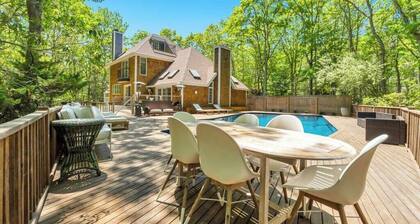 Stunning shingled Water Mill estate featuring a private heated pool and...